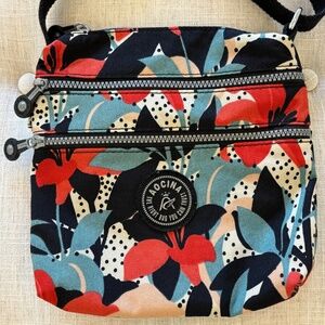 AOCINA lightweight nylon crossbody travel bag with a multi-color floral and polk